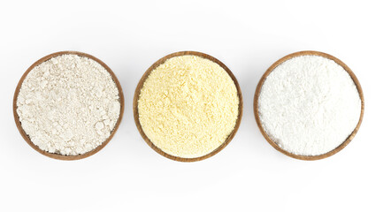 Baking ingredients background: gluten free rice, corn, oatmeal on a white background. Top view. Assortment of alternative, gluten-free flours. 