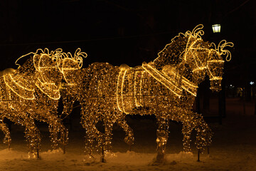 Christmas street decorations, twinkling garlands adorn the fabulous horses and carriage. New Year's...