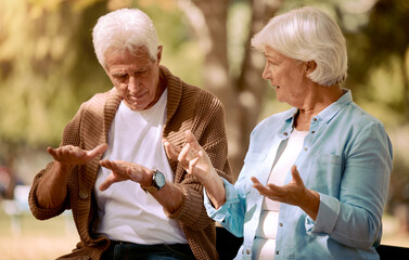 Senior couple, love and hands in sign language communication in nature, public park or garden....