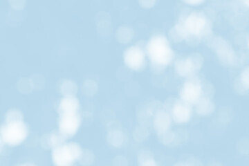 Abstract light blue blur bokeh for background, light blur on high light blue gradient abstract background in central design for presentation.