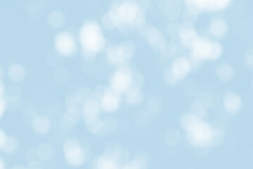 Abstract light blue blur bokeh for background, light blur on high light blue gradient abstract background in central design for presentation.