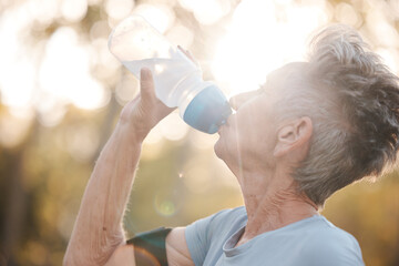Fitness, senior woman and drinking water during a break from exercise workout or training in a...