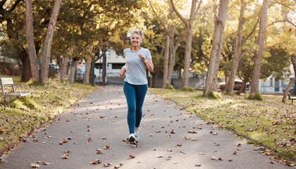 Exercise, senior and woman running in park for fitness, health and wellness mock up. Sports, retirement and happy elderly female from Canada jog, exercising or training outdoors alone for marathon.