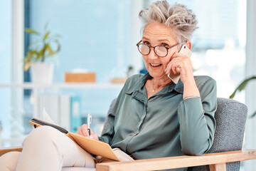 Senior, business and woman on phone call while writing corporate ideas in a notebook during...