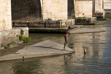 Sculpture of a Woman jumping into the River in Skopje, Macedonia.