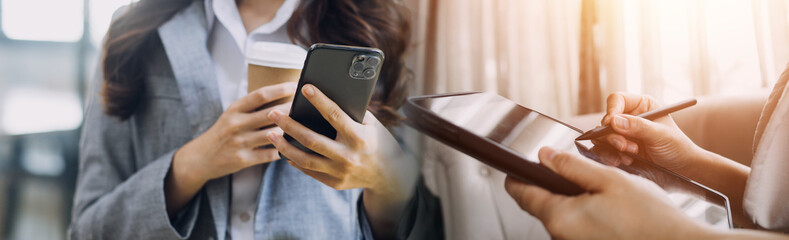 Business team present. professional investor working new start up project. Finance managers meeting.Digital tablet docking screen computer design smart phone using, in morning light