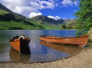 Long row boats moored on a mountain lake