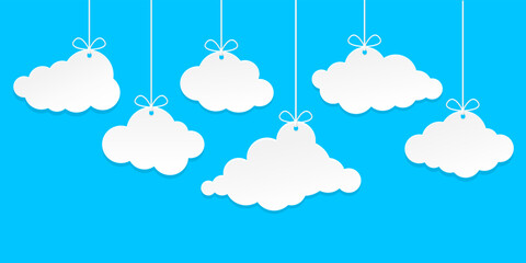 Set of clouds hangs on blue background.