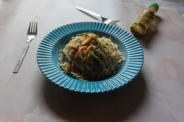 Close up of Indian style noodles chow mein in a plate. Selective focus. 