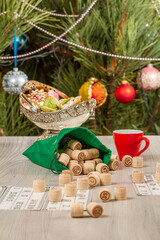 Cup of coffee, oranges and lotto barrels with bag, game cards for a game in lotto.