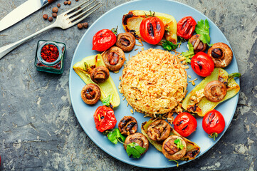 Roast vegetables with rice garnish, vegetarian dish