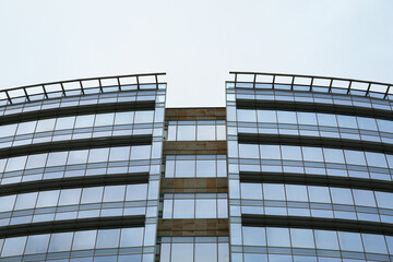 Fototapeta na wymiar Low angle view of modern building with many windows against clear sky