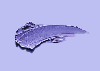 Cosmetic mask concealer or eye shadow texture smudge on violet purple background