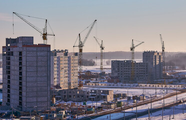 Fototapeta na wymiar structural steel beam builds large residential buildings on the construction site.
