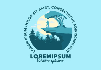 Mountain climbers standing on the edge of a cliff under a shady tree