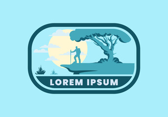 Mountain climbers standing on the edge of a cliff under a shady tree