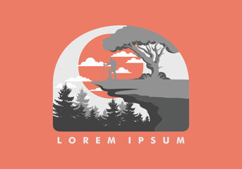 Mountain climbers standing on the edge of a cliff under a shady tree