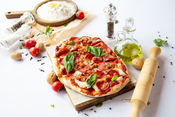 Pizza with vegetables on a white background.