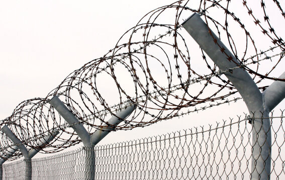 Barbed wire border security fence example