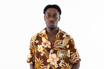 Portrait of serious concentrated handsome african american man guy looking at camera thinking wearing colorful shirt.