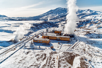 Aerial view to geothermal power plant in mountain. Clean green renewable energy in Kamchatka. - 550791968