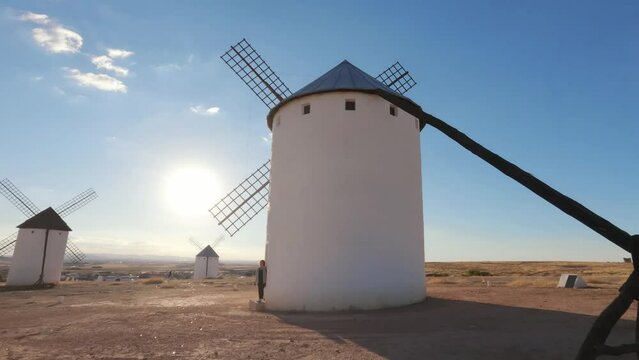 Circling around an old windmill at sunset