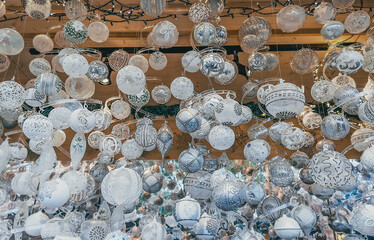 selective focus on Christmas tree toys balls at the Christmas fair. Counters with different balls