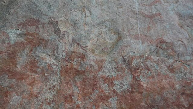 ancient san Bushmen paintings on the inside of a protected rock wall by African tribe tens of thousands of years ago in Zimbabwe