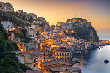 Scilla, Italy on the Mediterranean coast at dusk.