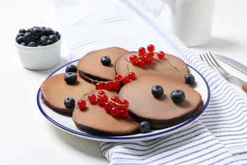 Concept of sweet food, chocolate pancakes, close up