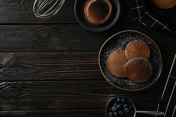 Concept of sweet food, chocolate pancakes, space for text