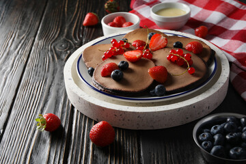 Concept of sweet food, chocolate pancakes, space for text