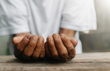 Male wrinkled hands, old man is wearing