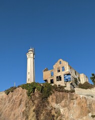 Low angle shot of the ruined Alcatraz Prison with blue sky in background