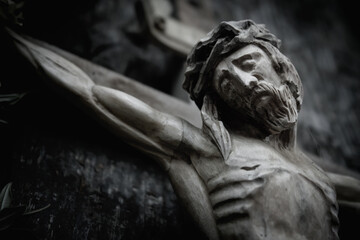 Ancient wooden statue of holy cross with crucified Jesus Christ. Horizontal image.