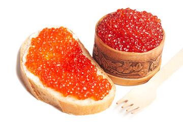 delicious red caviar in wooden bowl and sandwich with red caviar isolated on white background.