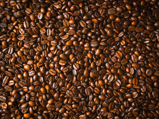 fresh coffee beans after roast as the background texture