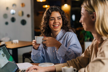 Employee has a conversation with a cafe manager