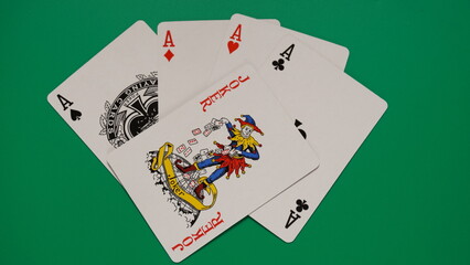 The combination of playing cards poker casino. Four aces and joker