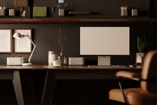Modern stylish office desk with computer mockup on table against the black wall with black pegboard