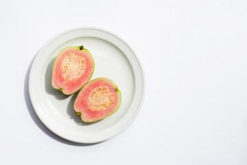 Fresh pink guava on white background.
