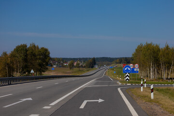 Highway wide road, transport and blue sky with clouds on a summer day