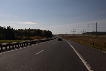 Highway wide road, transport and blue sky with clouds on a summer day