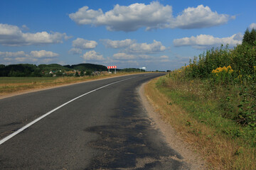Highway wide road, transport and blue sky with clouds on a summer day