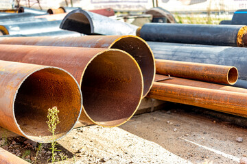 Various pipes used on a construction site. Pipes of different diameters in a construction...