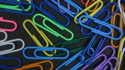 Paper clip isolated on a black background