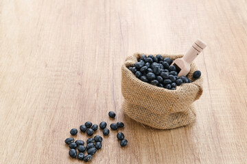 Fototapeta na wymiar Black soybean seeds (kacang kedelai hitam), food ingredients 