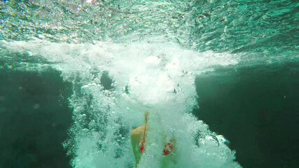 Red bikini, excitement and woman jumping into a lake to swim while on vacation or holiday for tourist fun. Excited, swimwear and swimming in a natural pond while on a getaway to travel - Powered by Adobe
