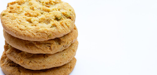 Pistachio and almond cookies on white background.