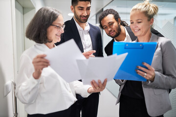 Business people are happy about contract documents
